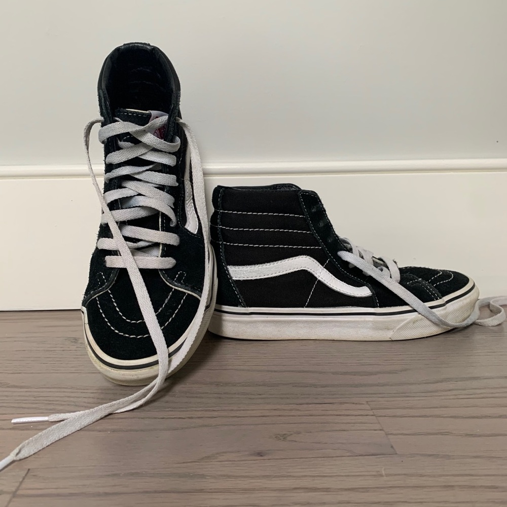 Black and white “off the wall” Vans